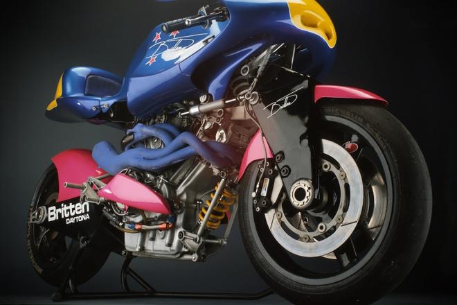Museum visitor climbs on motorcycle exhibit image