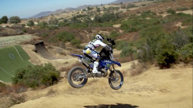 FMX rider pulls off crazy stunt with dog image