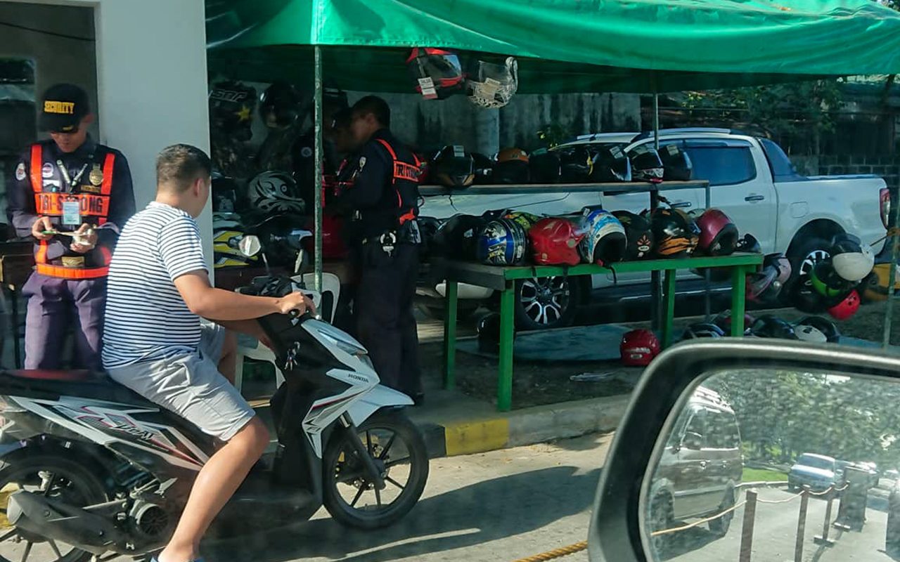 Cainta village forces riders to surrender their motorcycle helmets
