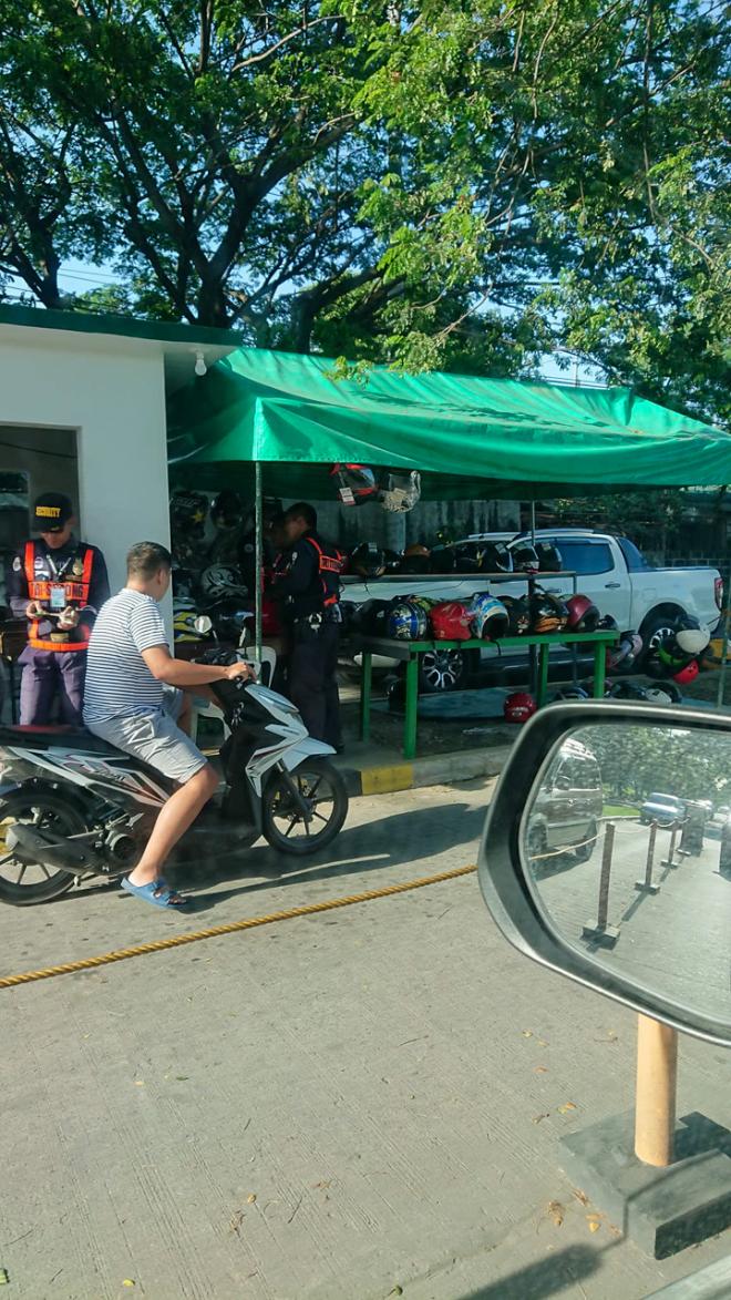 A private village in Cainta requires motorcycle riders to surrender their helmets image