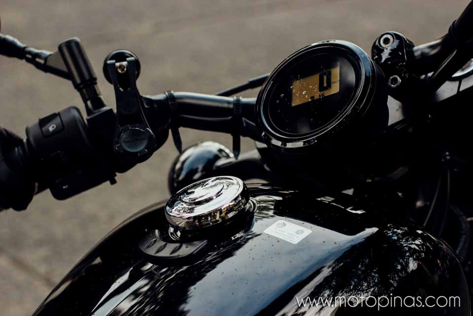 The circular gauge cluster and gas cap lid of the Yamaha Bolt