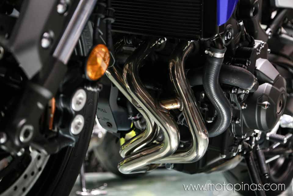 The radiator and three-cylinder headers on the Yamaha Tracer 900
