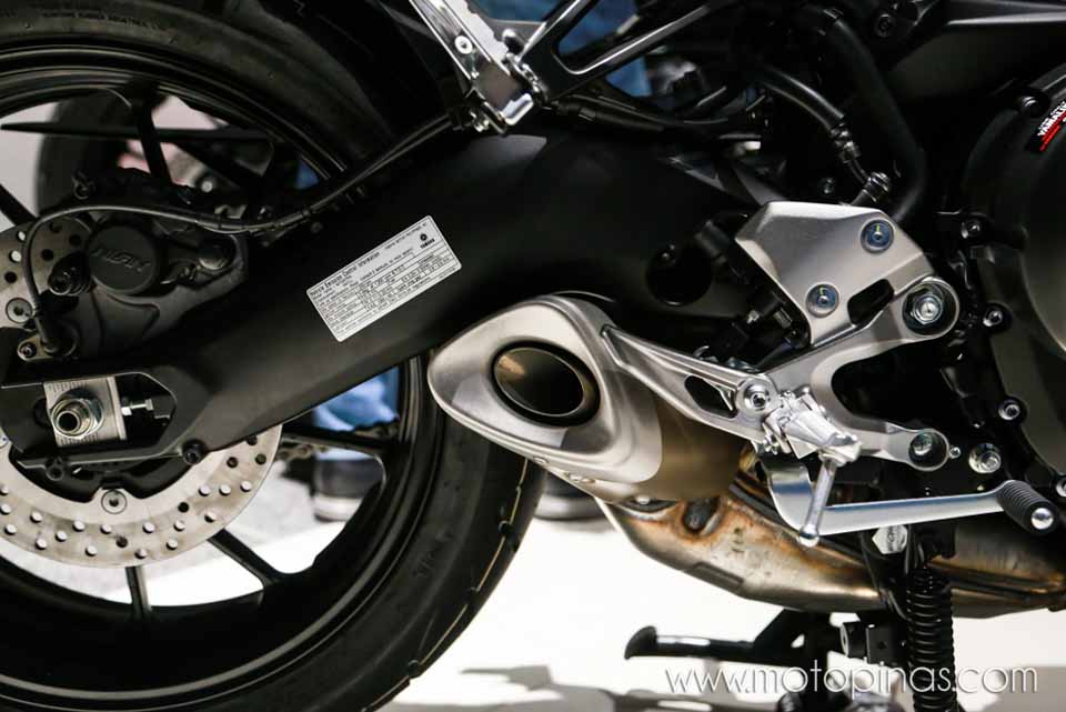 The rear disc brakes and exhaust pipe of the Yamaha Tracer 900
