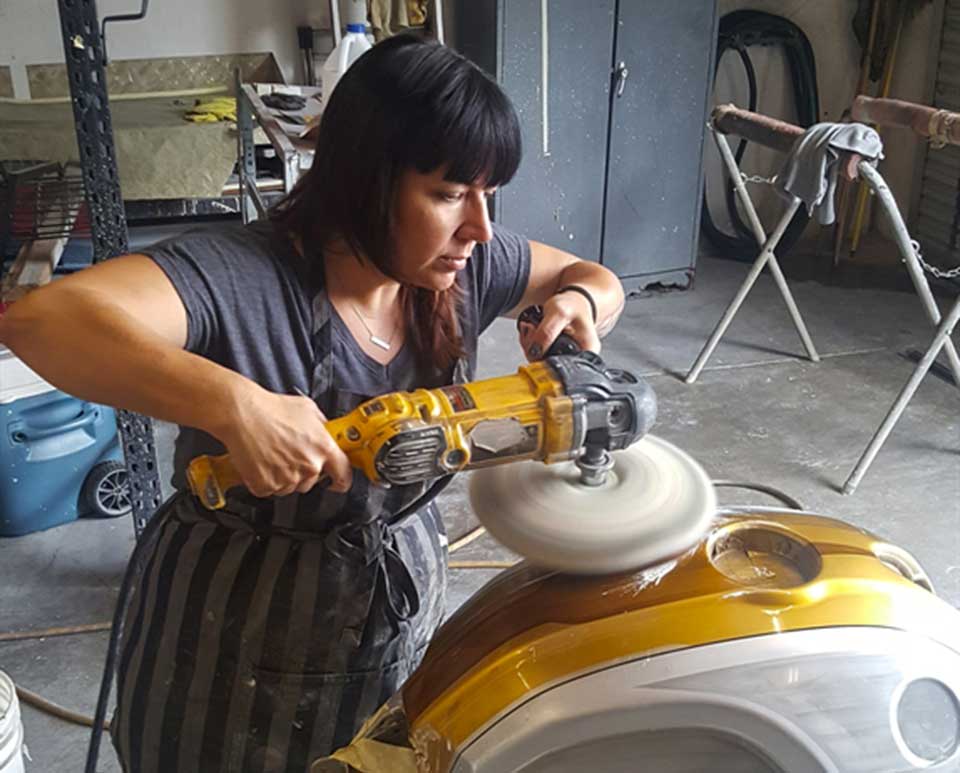 Theresa buffing the tank cover