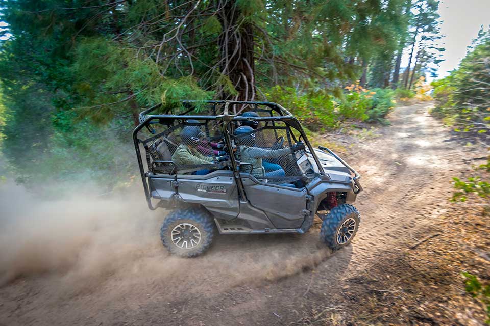The Honda Pioneer 1000 LE kicking up some dirt